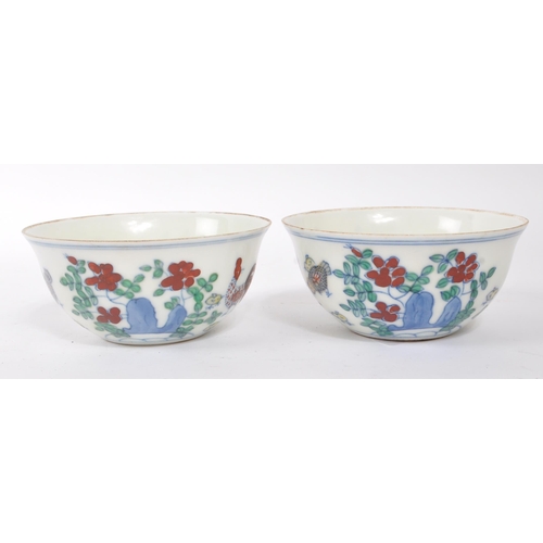 98 - A pair of early 20th Century Chinese porcelain tea bowls having hand painted motif of rooster / chic... 