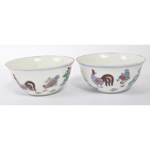 98 - A pair of early 20th Century Chinese porcelain tea bowls having hand painted motif of rooster / chic... 