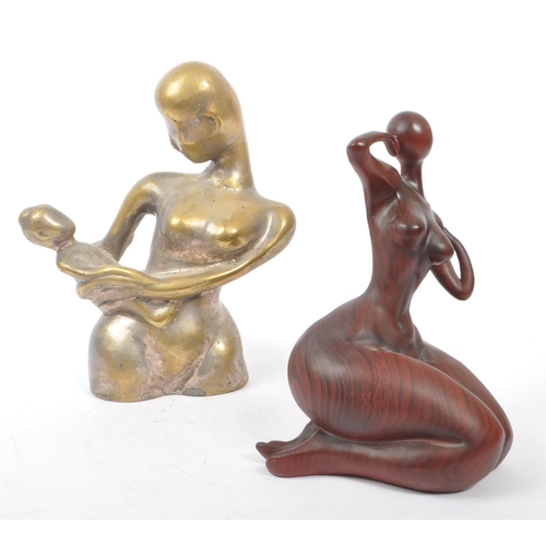 205A - A contemporary brass worked mother and child minimalist sculpture of heavy cast form - 20th century.... 