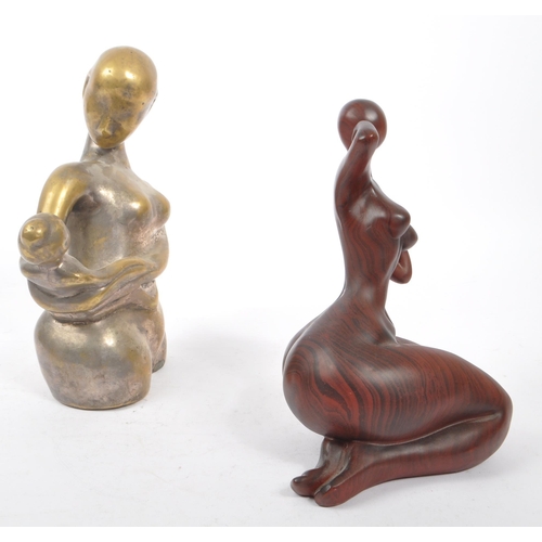 205A - A contemporary brass worked mother and child minimalist sculpture of heavy cast form - 20th century.... 