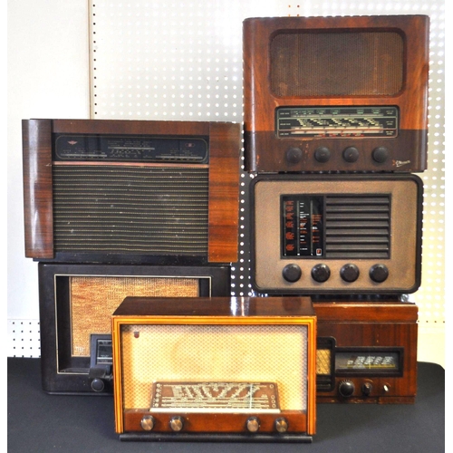 423 - A collection of vintage mid 20th century valve radios. The collection to include a Marconi T.9A radi... 