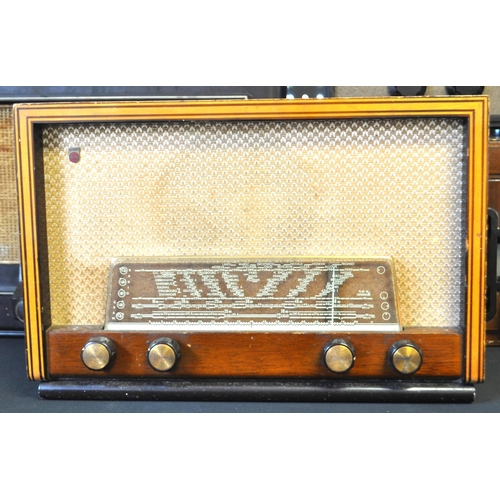 423 - A collection of vintage mid 20th century valve radios. The collection to include a Marconi T.9A radi... 