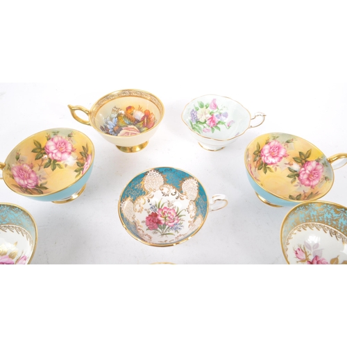 74 - Aynsley - A collection of ten 20th Century fine bone china porcelain cabinet teacups majority stampe... 