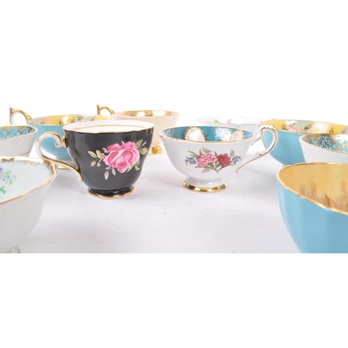 74 - Aynsley - A collection of ten 20th Century fine bone china porcelain cabinet teacups majority stampe... 