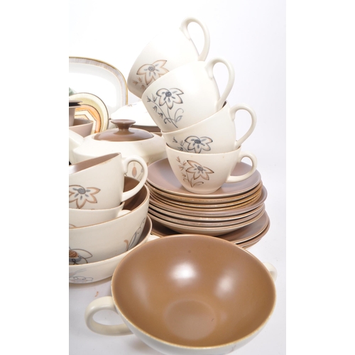 91 - Poole Pottery - A large collection of mid 20th century Poole Pottery ceramic Twintone C54 tableware.... 