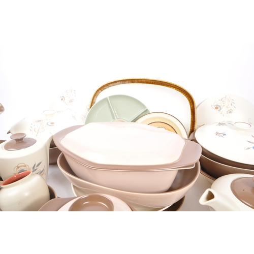 91 - Poole Pottery - A large collection of mid 20th century Poole Pottery ceramic Twintone C54 tableware.... 