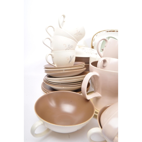 91 - Poole Pottery - A large collection of mid 20th century Poole Pottery ceramic Twintone C54 tableware.... 