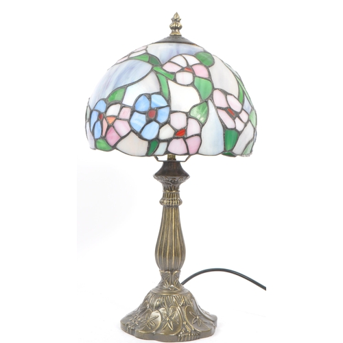 215A - A contemporary 20th century reproduction Tiffany lamp having shaped stem and mushroom leaded and sta... 