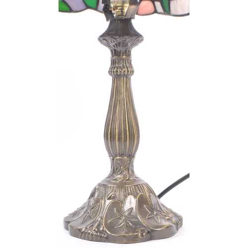 215A - A contemporary 20th century reproduction Tiffany lamp having shaped stem and mushroom leaded and sta... 