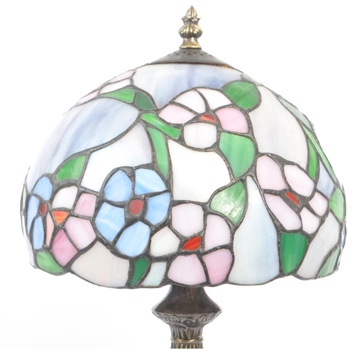 215A - A contemporary 20th century reproduction Tiffany lamp having shaped stem and mushroom leaded and sta... 