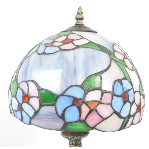 215A - A contemporary 20th century reproduction Tiffany lamp having shaped stem and mushroom leaded and sta... 