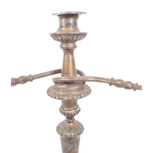 288 - An early 20th Century large silver plated twisted twin arm candelabra having scalloped edge detailin... 