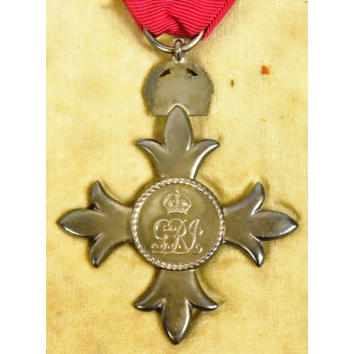 107 - An original Most Excellent Order of the British Empire MBE medal. A civil award example with George ... 