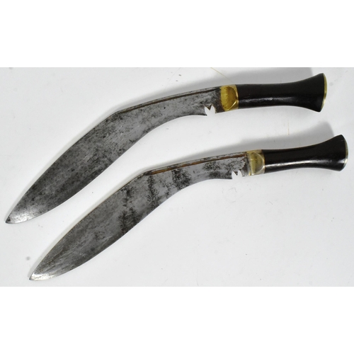 119 - Two vintage Nepalese / Gurkha Kukri knife daggers. Brass capped pommels with smooth wooden grips, br... 