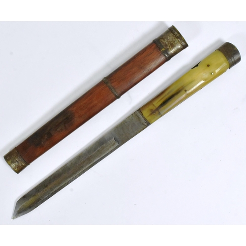 120 - A 19th Century Tibetan ethnic dagger. Capped metal pommel with a rhino horn grip secured with rivets... 