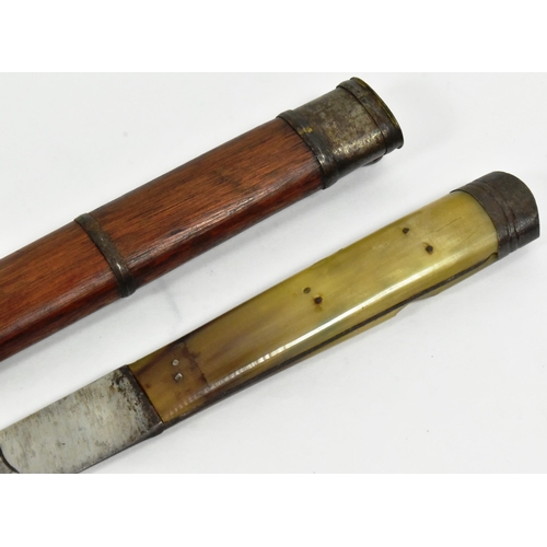 120 - A 19th Century Tibetan ethnic dagger. Capped metal pommel with a rhino horn grip secured with rivets... 