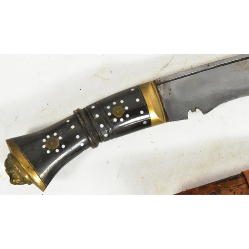 121 - An early 20th Century Nepalese / Gurkha Regiment Kukri knife dagger. The knife having a brass lion h... 