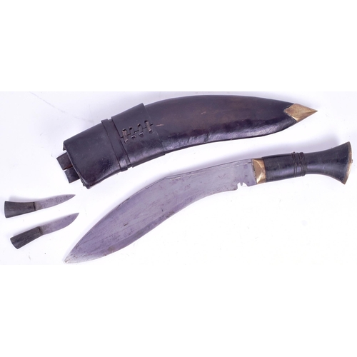 149 - An early 20th Century Nepalese / Gurkha Regiment Kukri knife dagger. The knife having a flat pommel ... 