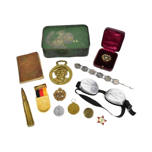 152 - A collection of assorted First and Second World War militaria to include; WWI Victory medal awarded ... 