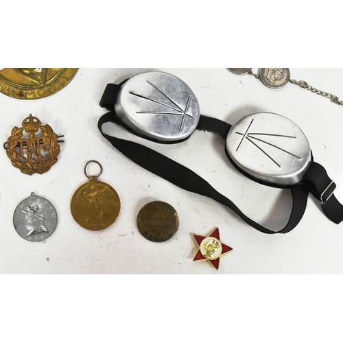 152 - A collection of assorted First and Second World War militaria to include; WWI Victory medal awarded ... 