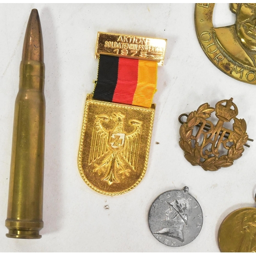 152 - A collection of assorted First and Second World War militaria to include; WWI Victory medal awarded ... 