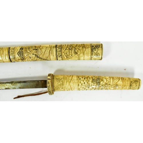 154 - A 20th Century Japanese Samurai Wakizashi sword and Tanto knife. Both with bone scrimshaw handle and... 