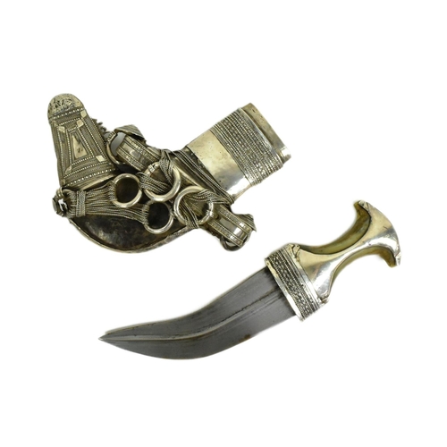 172 - An early 20th Century Middle Eastern / Omani Khanjar / Jambiya dagger. Waisted Rhino horn grip with ... 