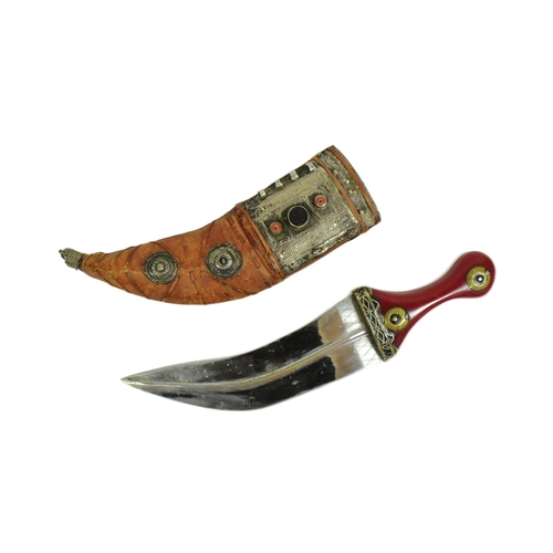 174 - An early 20th Century South Arabian / Yemen Jambiya knife / dagger. Red Bakelite grip with applied c... 