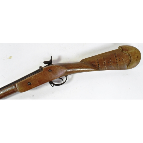 178 - A 19th Century Middle Eastern percussion cap musket rifle modification. Carved wooden jezail style s... 