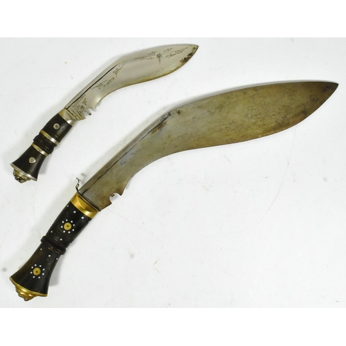 181 - Two vintage Nepalese / Gurkha style kukri knife daggers. Typical form with bone and horn hilts inlai... 