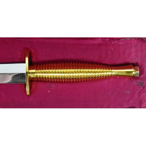 191 - An original British FS Fairbairn Sykes presentation commando dagger. Gilt metal grip and crossguard ... 