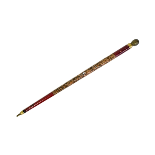 194 - A vintage combination walking stick and snooker cue. The globe shaped pommel unscrews to slide out t... 