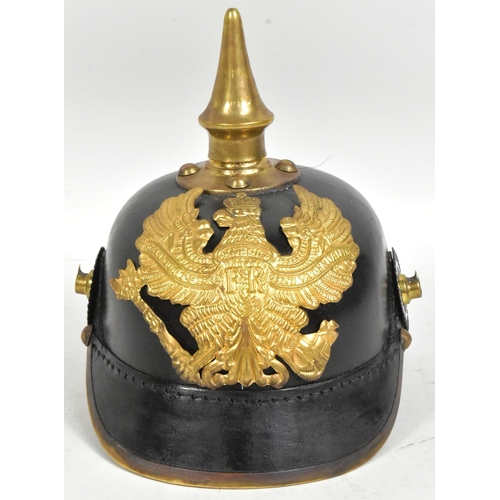 197 - A reproduction WWI First World War Imperial German / Prussian Army 1860 pattern pickelhaube helmet. ... 