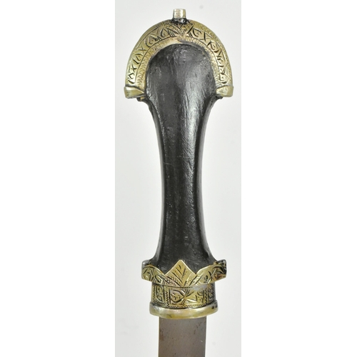 198 - An early 20th Century Moroccan Koummya Jambiya dagger. Dome shaped white metal pommel with a waisted... 