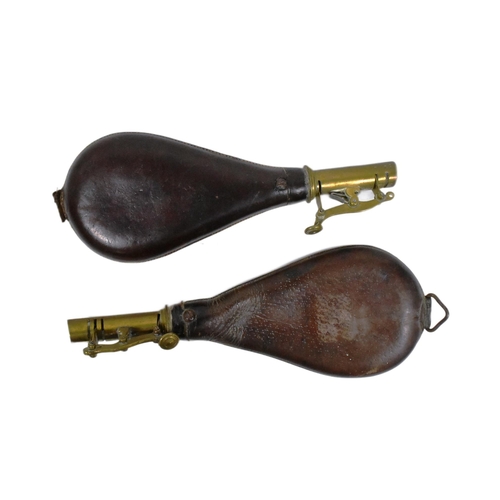 201 - Two early 20th Century Musket powder flasks. Brown leather pouches with brass necks and spring latch... 