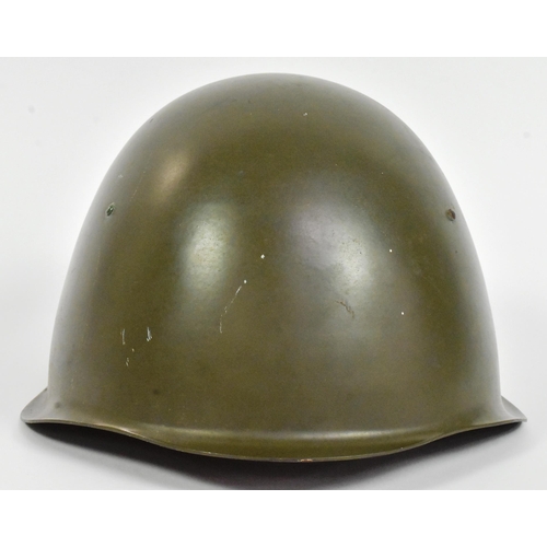 231 - A post War 1950s European believed Czech M53 steel combat helmet with x8 tongue leather liner and ch... 