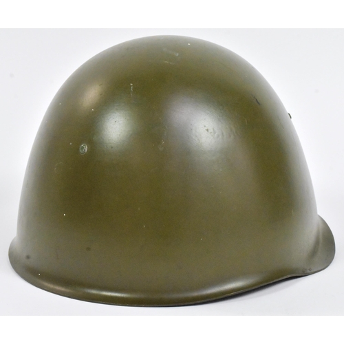 231 - A post War 1950s European believed Czech M53 steel combat helmet with x8 tongue leather liner and ch... 