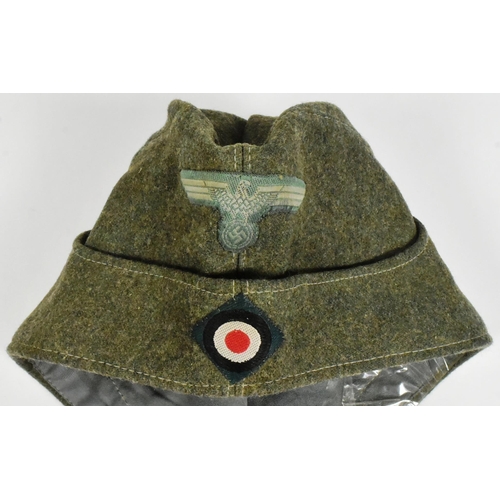 235 - A WWII Second World War Third Reich Nazi German Officers M43 overseas side cap. Field grey wool cons... 