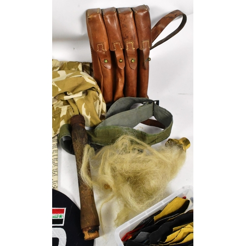 238 - A large collection of assorted militaria to include parts of British Military kit, Gulf War uniform ... 