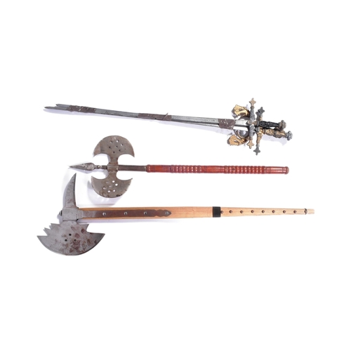 246 - A collection of replica medieval axes and Toledo style Spanish swords. Largest measures approx 105cm... 