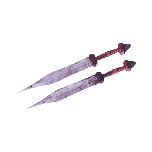 254 - A pair of African Central Sahara (Chad) Tubu People tribal daggers. Exposed metal pommels, plaited l... 