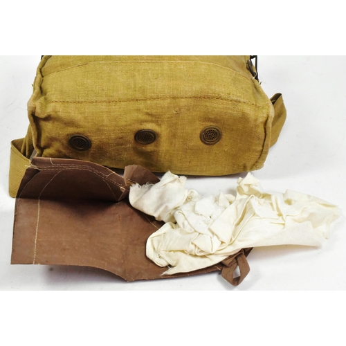 259 - An original WWII Second World War British Army issued Service Respirator / Gas Mask. Fabric lined ru... 