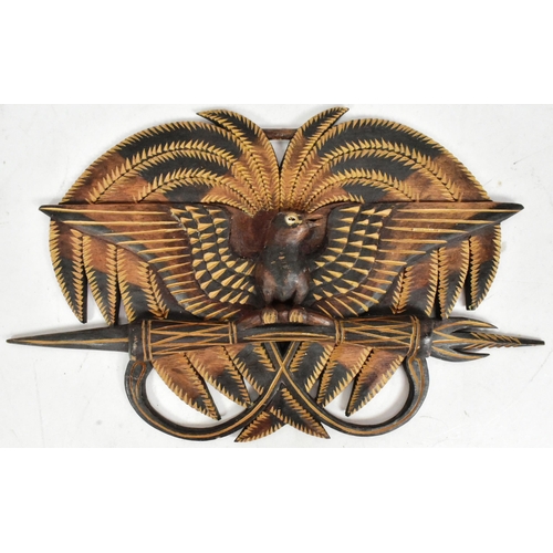 261 - A hand carved Papua New Guinea wooden Bird of Paradise wall plaque along with a small tribal Adze Ax... 