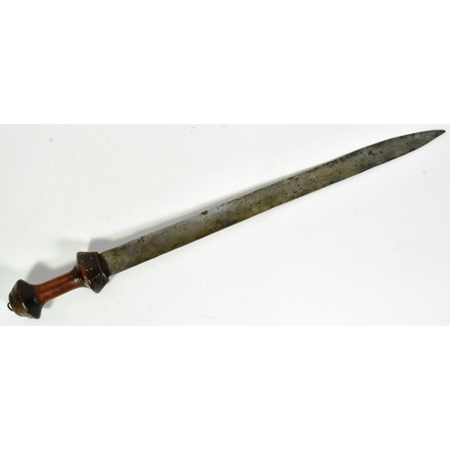 277 - A West African ( Sierra Leone ) Mende People tribal sword. Waisted wooden grip with inlaid metal riv... 