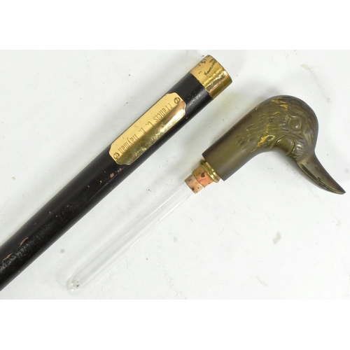 282 - A vintage Eagle headed walking stick / walking cane with a concealed glass drinking tube flask. The ... 