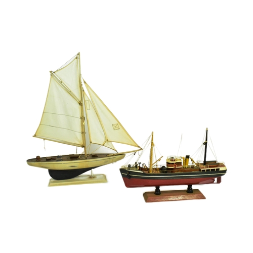 293 - Two vintage hand made scratch built model boats comprising a pond yacht with white sails and a steam... 