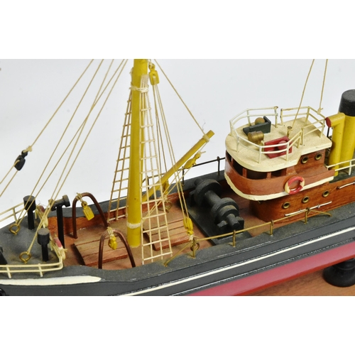 293 - Two vintage hand made scratch built model boats comprising a pond yacht with white sails and a steam... 