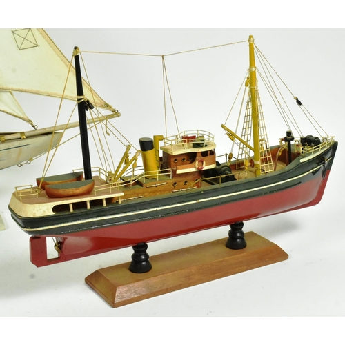 293 - Two vintage hand made scratch built model boats comprising a pond yacht with white sails and a steam... 