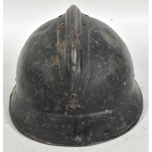 305 - A WWII Second World War French Milice helmet. The black Adrian pattern helmet with a metal ' Gamma '... 