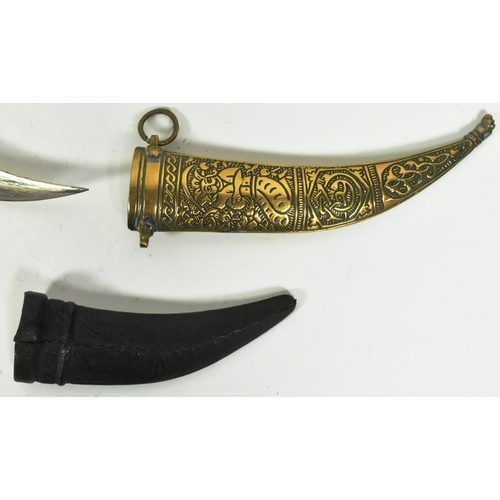 311 - A 19th Century Middle Eastern / Syrian Jambiya dagger together with a smaller Indo Persian Jambiya. ... 